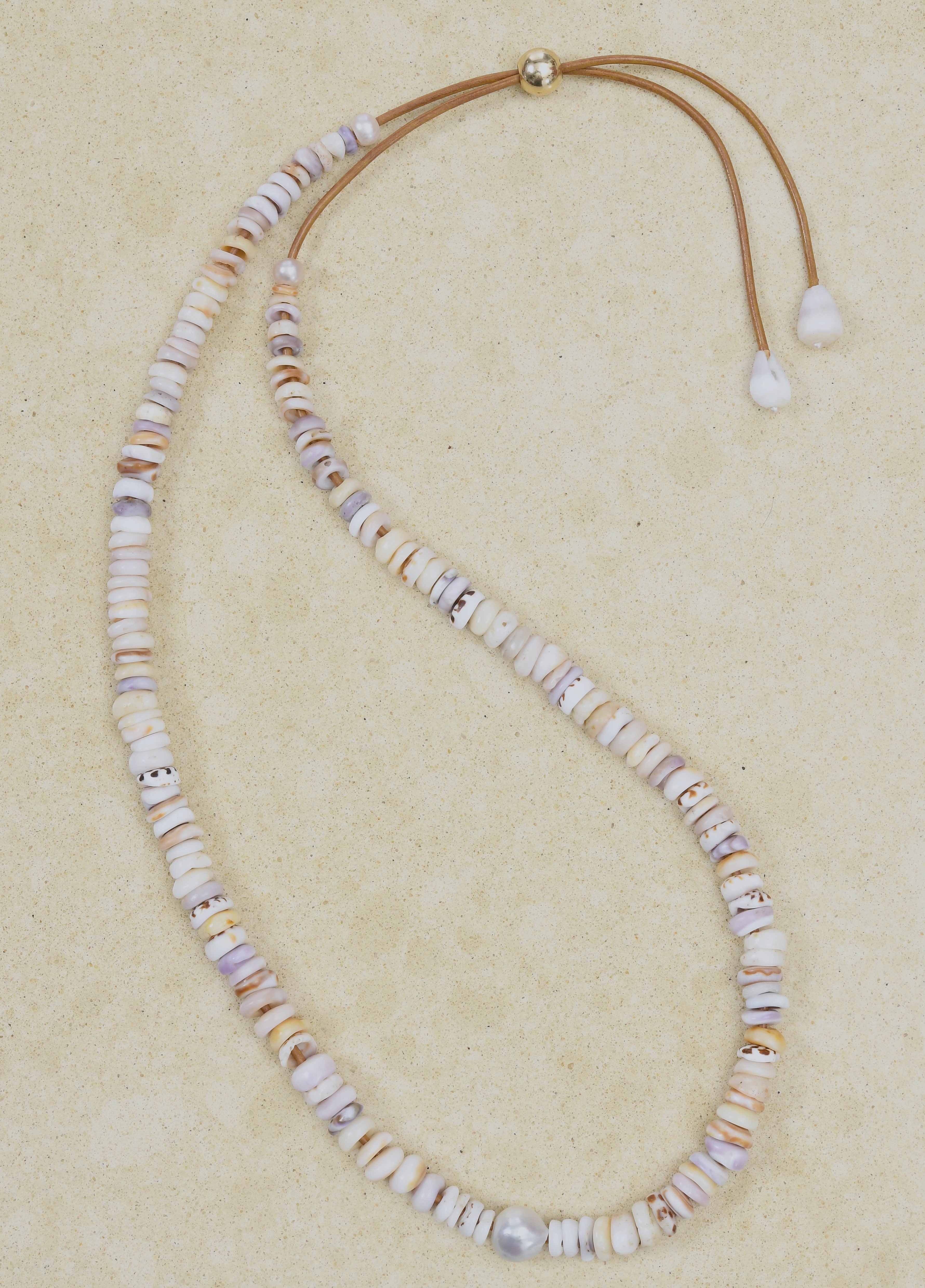 Puka lei with silver Baroque pearl and brown adjustable cord
